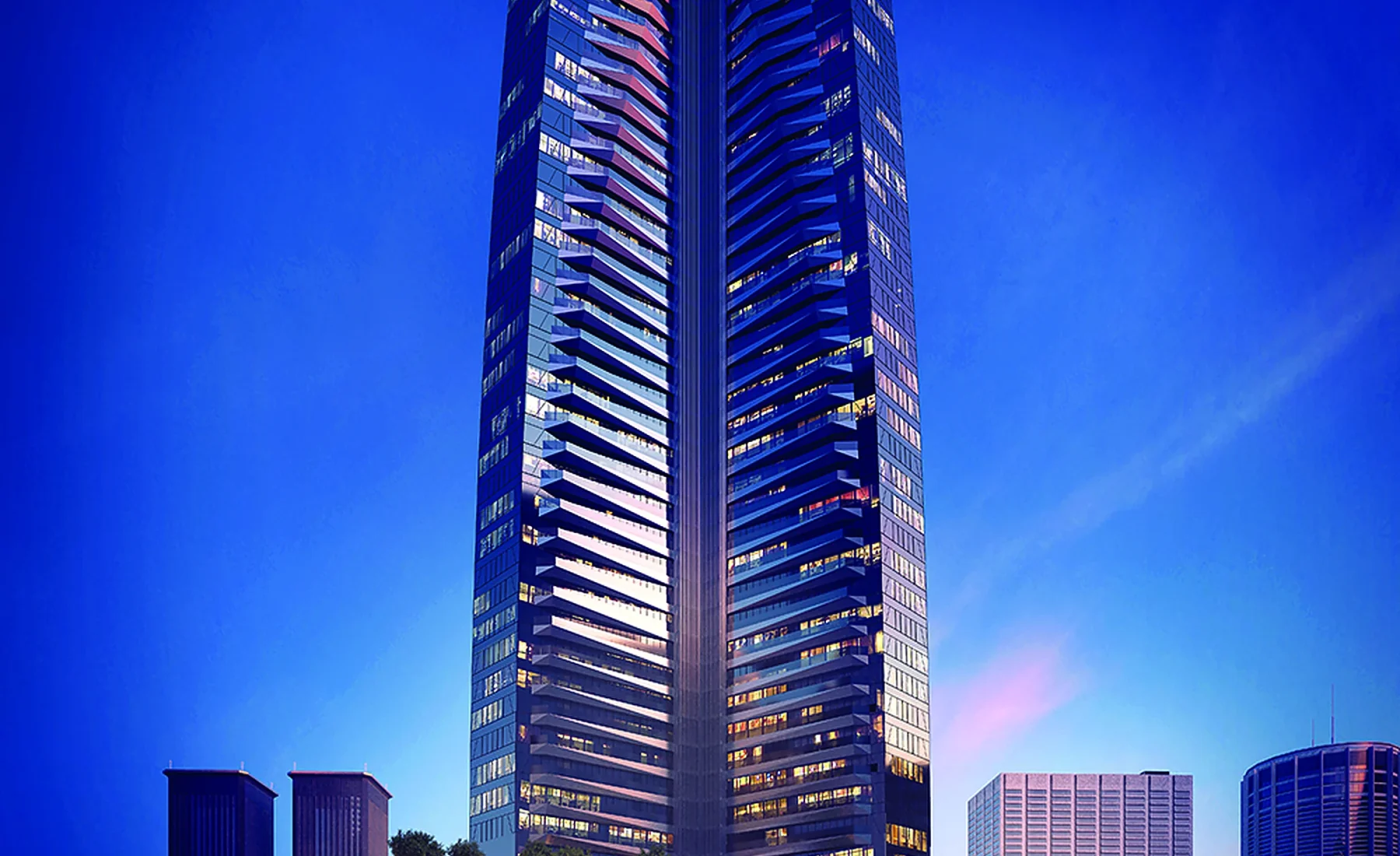 ETRO Residences tower illuminated against an evening sky